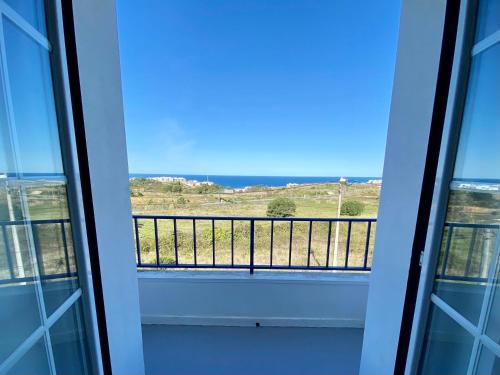 a balcony with a view of the ocean at Ericeira Sand Beach F7 in Ericeira