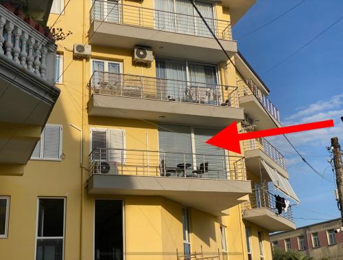a building with a red arrow pointing to a building at White Luxury in Shkodër