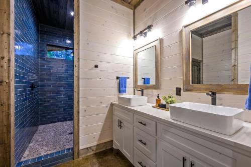 a bathroom with two sinks and a shower at Brand New Luxury 2 Bedroom with Loft and Spa Sleeps 10 in Broken Bow