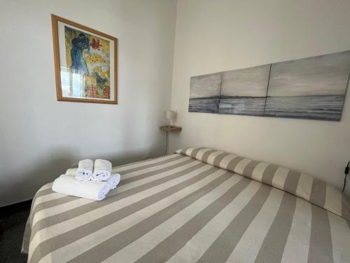 Letto o letti in una camera di Piccolo Hotel di Lavagna