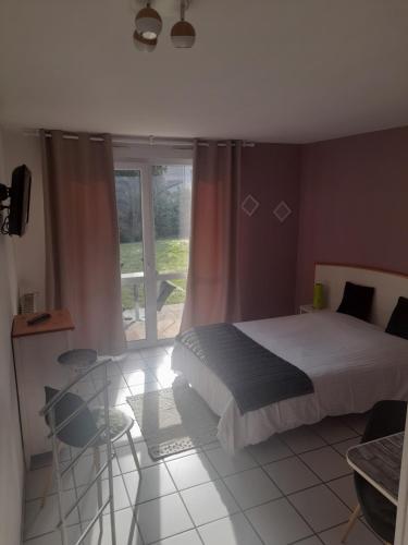 Katil atau katil-katil dalam bilik di Hotel de l'Ile d'Amour