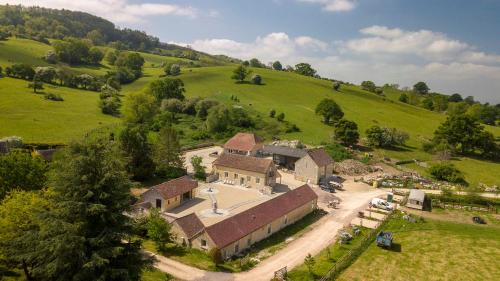 an aerial view of a house in a green field at Hayes Farm - 8 Houses in Gloucester