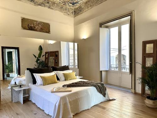 Ένα ή περισσότερα κρεβάτια σε δωμάτιο στο Casa Guilla_alla Cattedrale