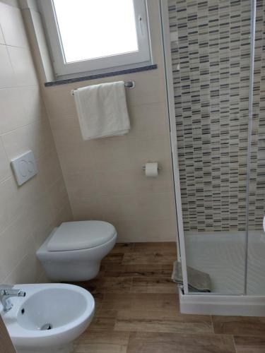 a bathroom with a toilet and a sink and a shower at Skylab in Gozzano