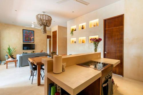 a kitchen and living room with a dining room at Casa Esperanza Tulum Private Pool in Tulum