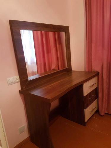 a wooden desk with a mirror on top of it at Arevik BB in Chʼiva