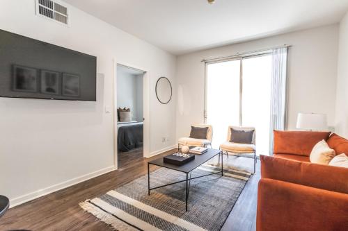 a living room with a couch and a table at 2BD 2BTH Condo 10 Min Walk to Santa Monica Beach in Los Angeles