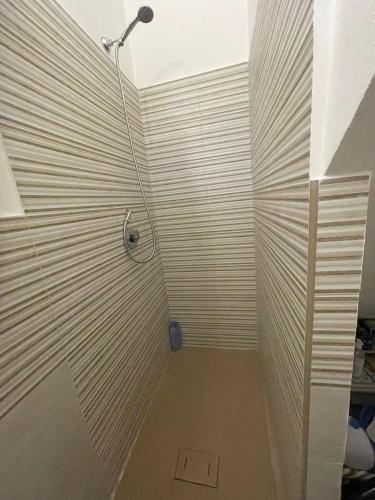 a bathroom with a shower stall with a shower at Spagna Apartament in Siracusa