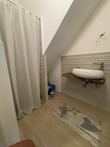 a bathroom with a bath tub sitting on a table at Spagna Apartament in Siracusa