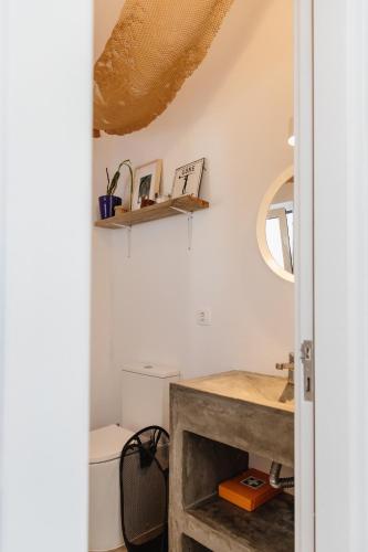 a bathroom with a sink and a toilet at Casa da Maria • Natural Côte • Aljezur in Maria Vinagre
