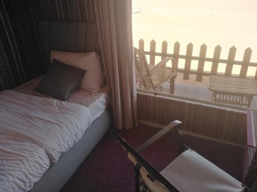 Postel nebo postele na pokoji v ubytování Wadi Rum Marcanã camp
