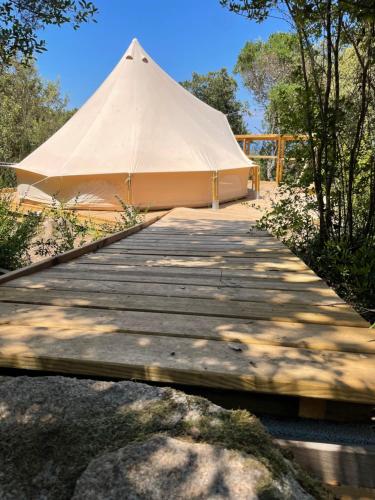 a large tent sitting on a wooden boardwalk at CORSICA NATURA #1 in Coti-Chiavari