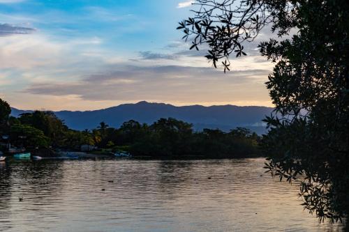 a view of a lake with mountains in the background at Oso de Osa in Sierpe