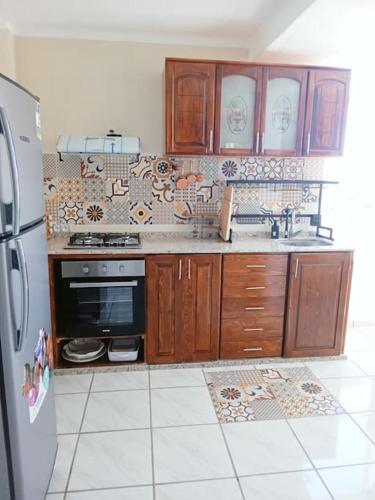 Kuchyň nebo kuchyňský kout v ubytování Bel appartement refait à neuf Bahia Smir