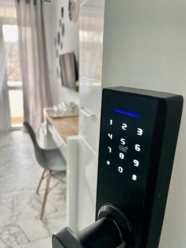 a close up of a remote control in a room at GlassRoom- Самостоятелна стая Private room in Varna City