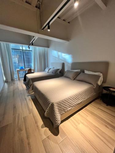Olson Hotel Real Acueductoにあるベッド