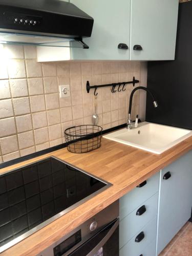 a kitchen with a sink and a counter at Hospitality M7 in Kallithea Halkidikis