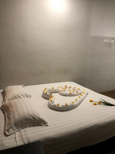 Katil atau katil-katil dalam bilik di Amigo Hotel