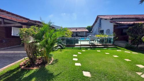 Taman di luar Village Itaúna Inn - Casas de Temporada para Famílias
