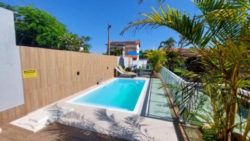 Kolam renang di atau dekat dengan Village Itaúna Inn - Casas de Temporada para Famílias