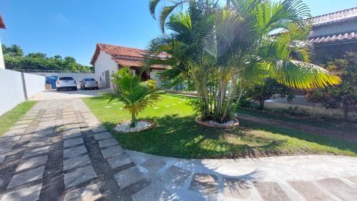 Taman di luar Village Itaúna Inn - Casas de Temporada para Famílias
