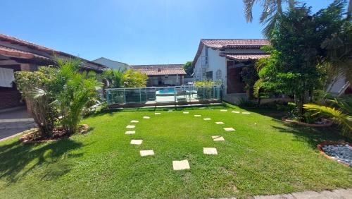Taman di luar Village Itaúna Inn - Casas de Temporada para Famílias