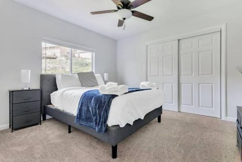 a bedroom with a bed and a ceiling fan at Near Downtown l Peaceful l Modern l Kids Room in Atascadero