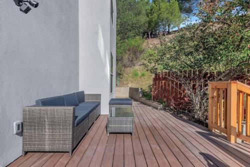 a patio with a couch and a table on a deck at Near Downtown l Peaceful l Modern l Kids Room in Atascadero