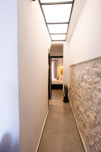 a hallway with a skylight in a house at VENUS LUXURY APARTMENT in Ermoupoli