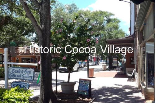 a sign that readshistoric cacoco village on a street at Florida Space Coast Waterfront Retreat in Cocoa