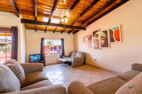 a living room with two couches and a tv at Condo 4 In town and steps to the beach and Malecon in San Felipe