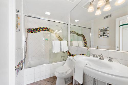 a bathroom with a toilet and a sink at Villa Calypso in Laguna Beach