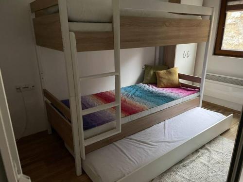 a couple of bunk beds in a room at Cosy apartment in Mavrovo in Mavrovo