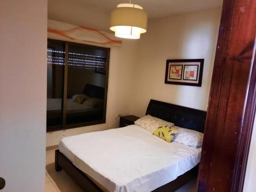 Posteľ alebo postele v izbe v ubytovaní Furnished apartment for rent In Abdoun شقة مفروشة للايجار في عبدون