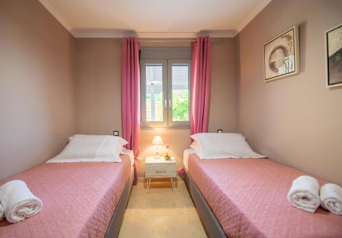 A bed or beds in a room at The View Villa