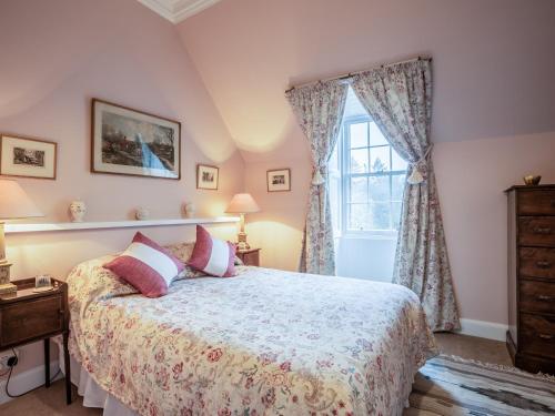 a bedroom with a bed and a window at Glen Apartment - Uk43813 in Ardovie