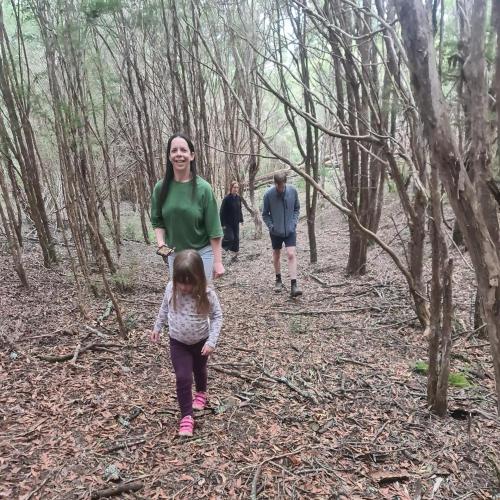 a woman and a child walking in the woods at The Hammock in Moondarra