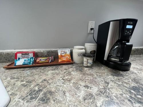 a counter top with a coffee maker and a coffeemaker at Bright, big family escape, W/parking, dogs welcome in Oak Park
