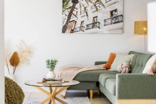 a living room with a couch and a table at Sandcastles at the Beach - Linen Supplied & Beds Ready on Arrival in Fingal Bay