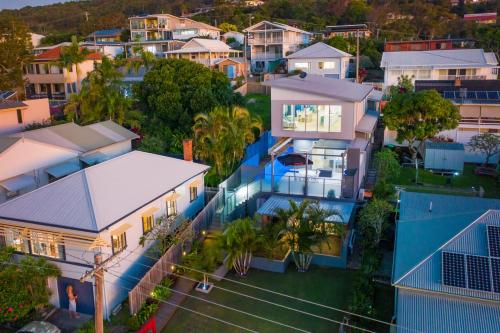an aerial view of a city with houses at Pacific House in Crescent Head