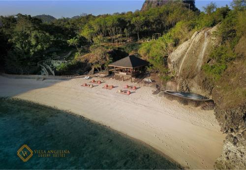 an aerial view of a beach with a gazebo at Villa Angelina Luxury Suites in Dapitan
