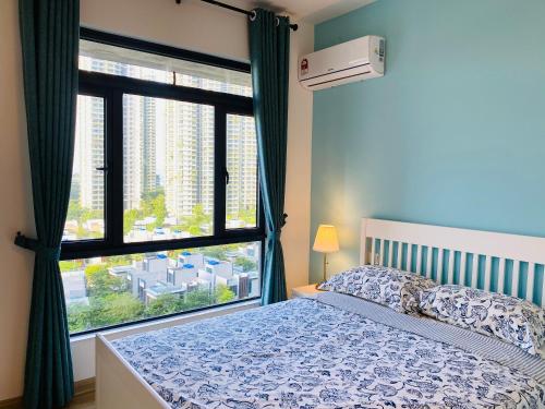 a bedroom with a bed and a large window at SeaView 2-bedroom Fully Furnished Apartment Forest City #freeWIFI in Gelang Patah