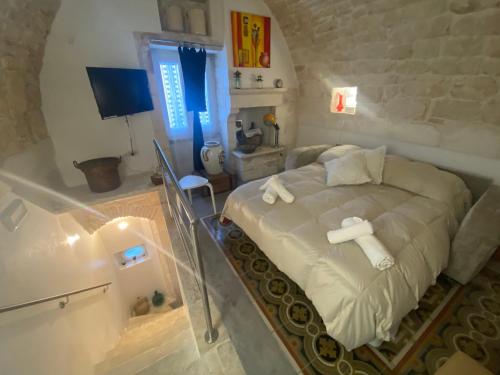 a bedroom with a bed in a small room at Residenza Le Tre Volte - colazione inclusa con TicketBar in Martina Franca