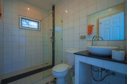 a bathroom with a toilet and a sink at Star 2 BR Private Pool Villa - Chalong in Chalong 