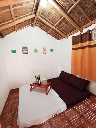 a living room with a couch and a table at Casa Astillero - Calatagan Batangas Private Resort in Calatagan