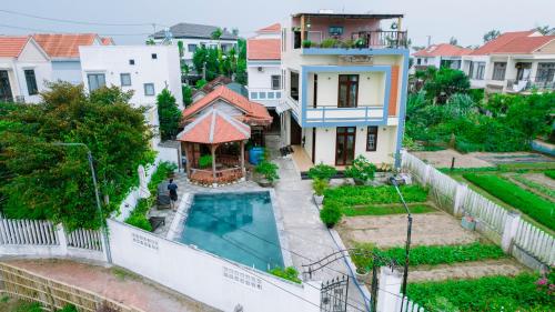 an aerial view of a house with a swimming pool at Tra Que Green Villa Hoi An in Hoi An