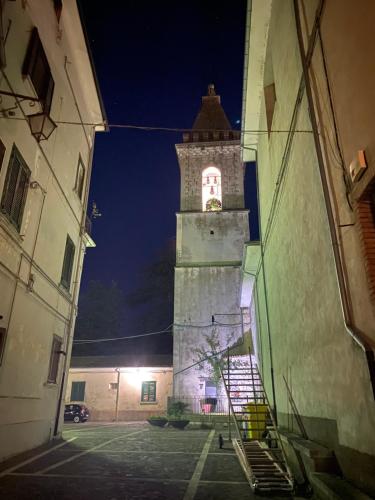 a tall tower with a clock on it at night at B&B Donna Livia in Cantalupo nel Sannio