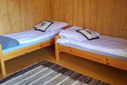 Säng eller sängar i ett rum på Domek Szlembark