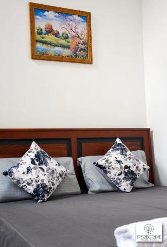 Ένα ή περισσότερα κρεβάτια σε δωμάτιο στο PEREGRINE Villa