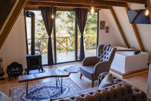 a living room with couches and a wood stove at Montana Suite Bungalows in Trabzon